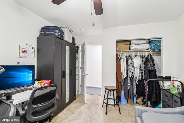 carpeted bedroom with ceiling fan and a closet