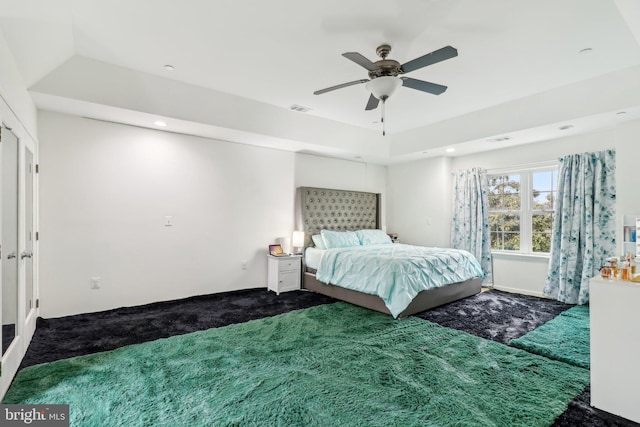 unfurnished bedroom with carpet, visible vents, and ceiling fan