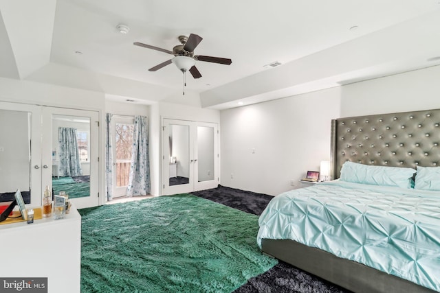 carpeted bedroom featuring access to exterior, french doors, visible vents, and ceiling fan