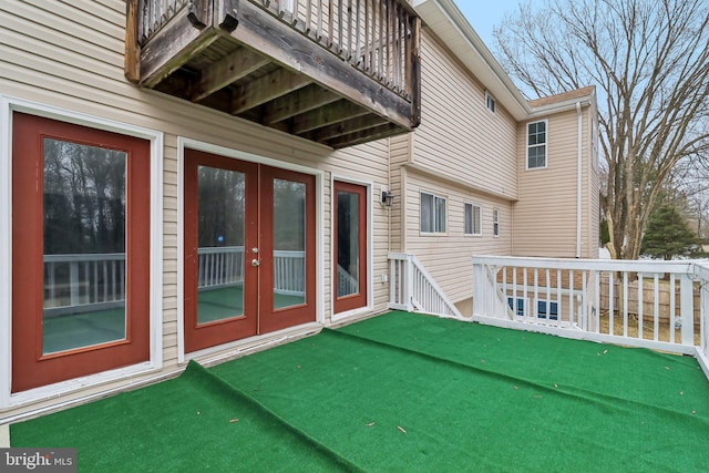 exterior space featuring a deck and french doors