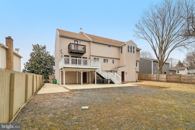 rear view of house featuring stairs, a patio, cooling unit, and a fenced backyard