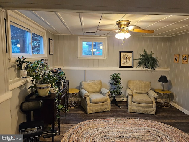 sitting room with visible vents and wood finished floors