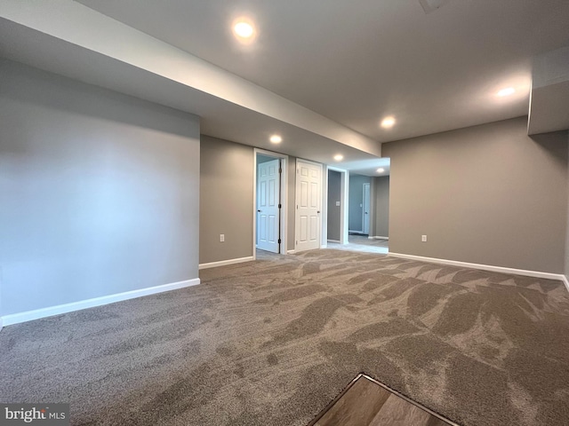 finished below grade area featuring recessed lighting, baseboards, and carpet floors