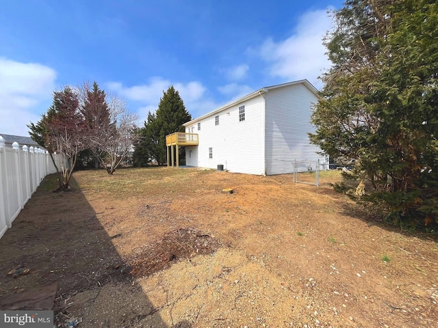 view of yard with a wooden deck and fence