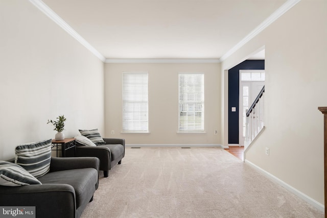 sitting room featuring ornamental molding, stairs, baseboards, and carpet floors