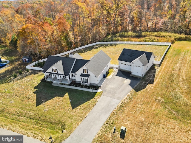 drone / aerial view featuring a view of trees