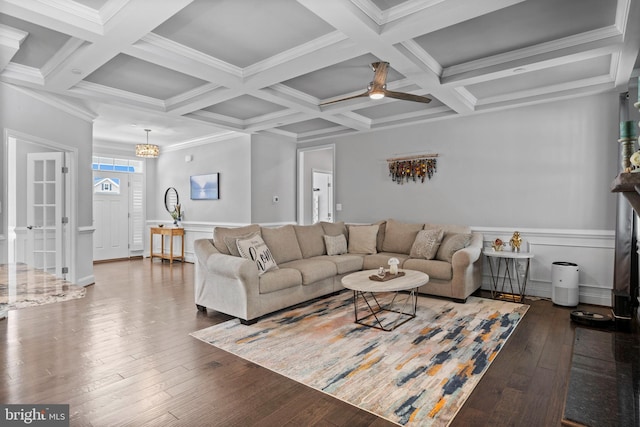 living room featuring coffered ceiling, beamed ceiling, and hardwood / wood-style floors