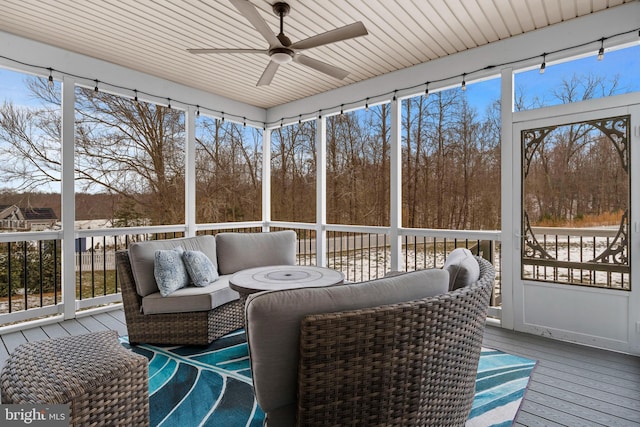 sunroom with plenty of natural light and a ceiling fan