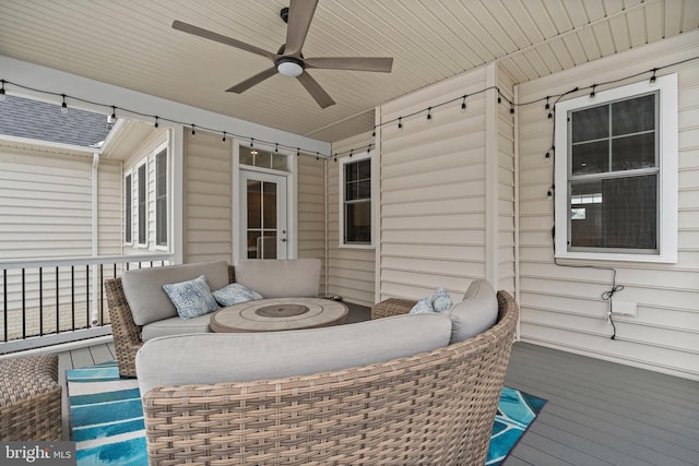 view of patio with an outdoor living space and a ceiling fan