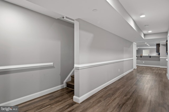 interior space featuring baseboards, wood finished floors, and recessed lighting