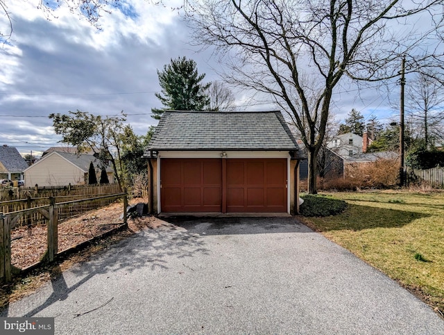 garage featuring fence