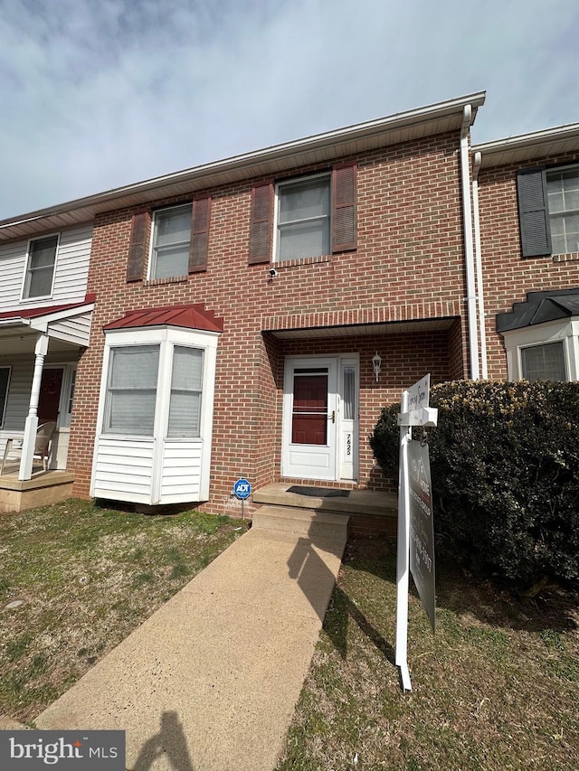 view of property with brick siding