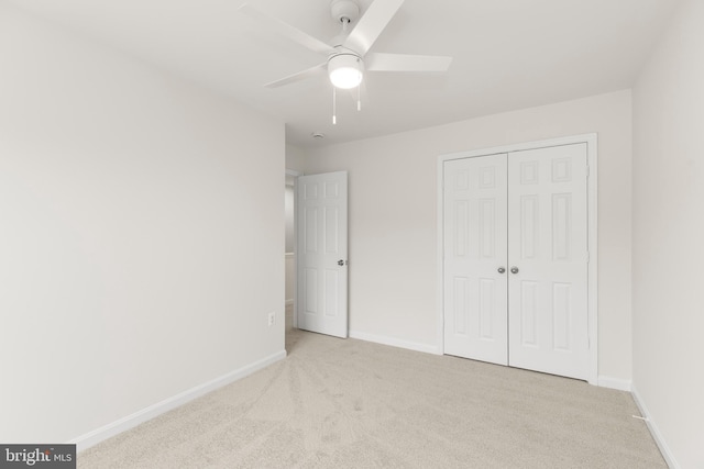 6185 Newton Ln, Bealeton, VA 22712 - unfurnished bedroom with carpet floors, a closet, baseboards, and a ceiling fan