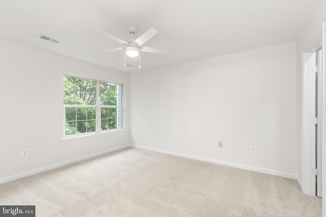 6185 Newton Ln, Bealeton, VA 22712 - spare room with light carpet, a ceiling fan, and baseboards