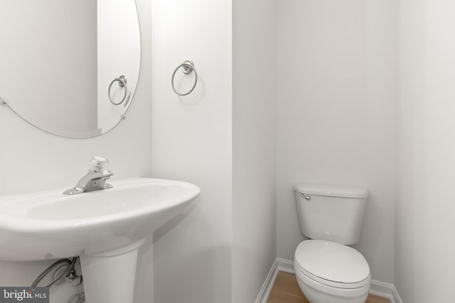 6185 Newton Ln, Bealeton, VA 22712 - bathroom featuring baseboards, toilet, and wood finished floors