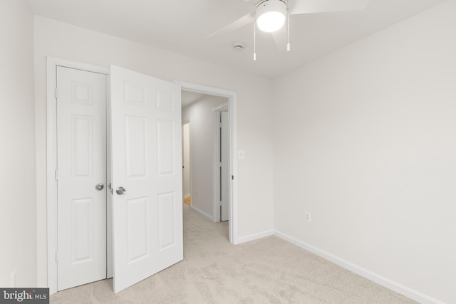 6185 Newton Ln, Bealeton, VA 22712 - unfurnished bedroom featuring light carpet, baseboards, and a ceiling fan