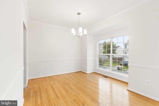 6185 Newton Ln, Bealeton, VA 22712 - spare room with ornamental molding, a chandelier, hardwood / wood-style floors, and baseboards