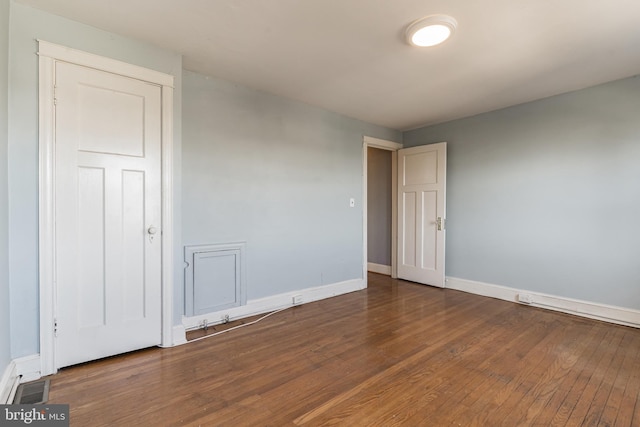 305 Drew St, Baltimore, MD 21224 - spare room featuring hardwood / wood-style floors, visible vents, and baseboards
