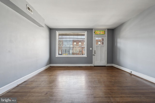 305 Drew St, Baltimore, MD 21224 - entrance foyer with baseboards, visible vents, and wood finished floors