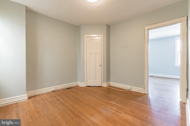 305 Drew St, Baltimore, MD 21224 - unfurnished room featuring visible vents, baseboards, and wood finished floors