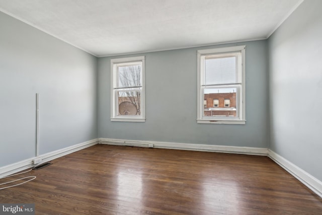 305 Drew St, Baltimore, MD 21224 - empty room featuring baseboards, ornamental molding, and wood finished floors
