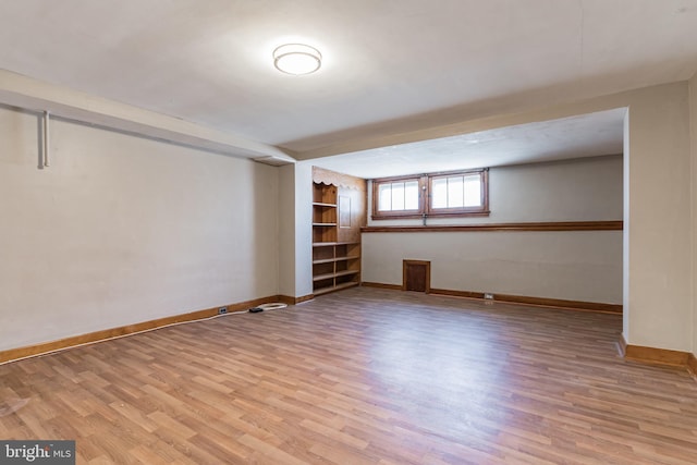 305 Drew St, Baltimore, MD 21224 - below grade area with wood finished floors and baseboards