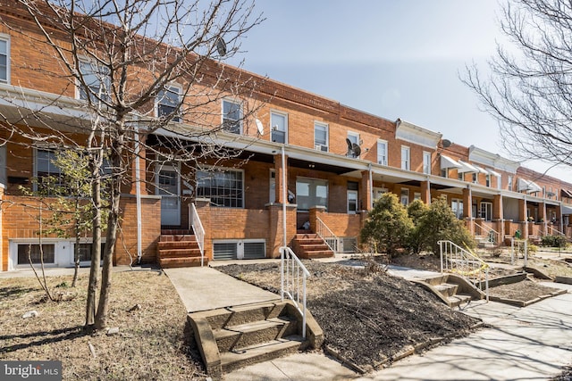 view of front of house with brick siding