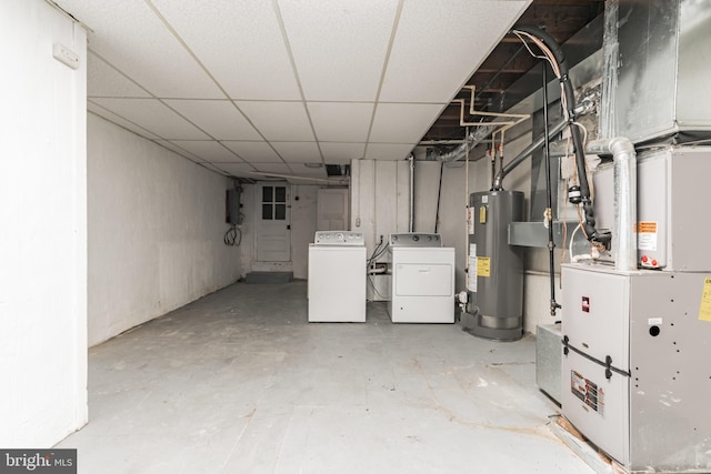 305 Drew St, Baltimore, MD 21224 - unfinished basement featuring water heater, independent washer and dryer, a paneled ceiling, and heating unit