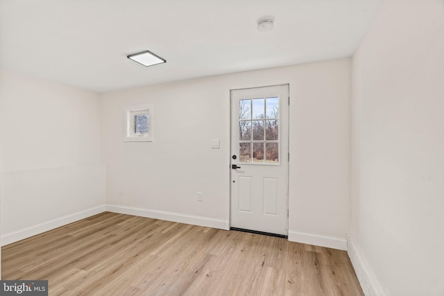 interior space with light wood-style flooring and baseboards