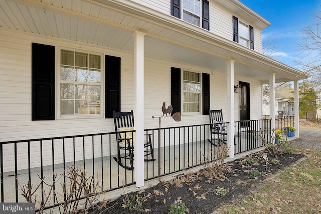 property entrance with covered porch