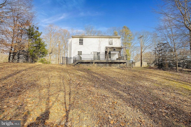 rear view of property with a deck