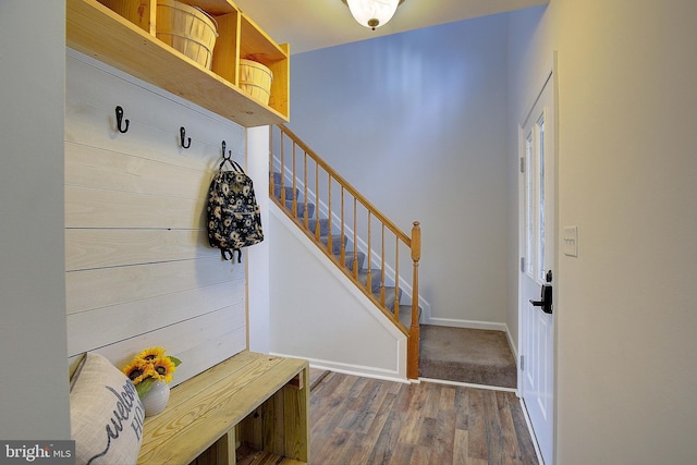 mudroom featuring baseboards and wood finished floors