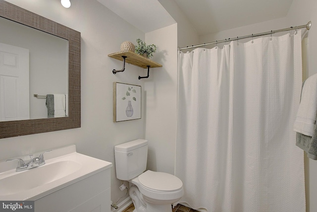 full bathroom with toilet and vanity