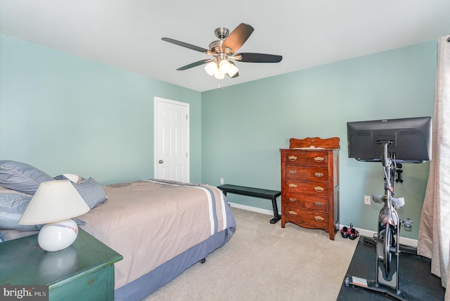 carpeted bedroom with baseboards and ceiling fan