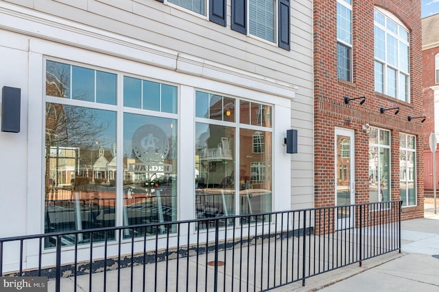 doorway to property featuring brick siding