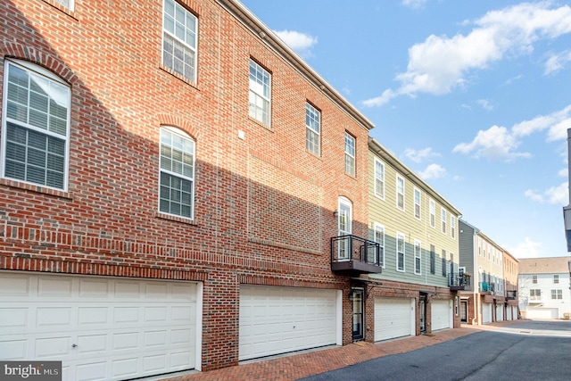 view of property featuring community garages