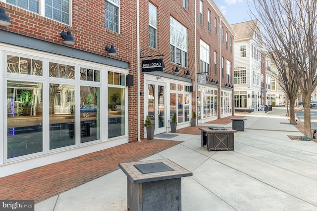 exterior space featuring a residential view and an outdoor fire pit