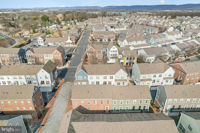 drone / aerial view featuring a mountain view and a residential view