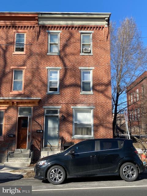 view of front of home with brick siding