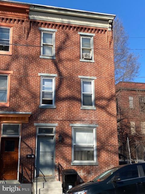 exterior space with brick siding