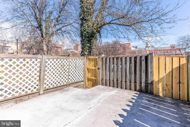 view of patio / terrace featuring fence and a gate