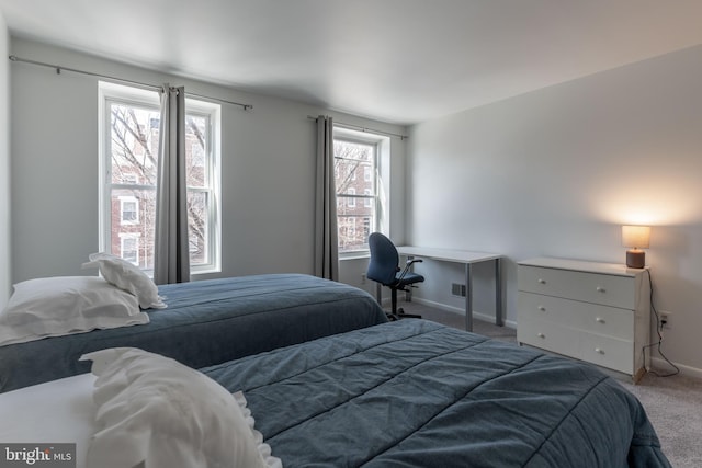 bedroom with carpet, visible vents, and baseboards