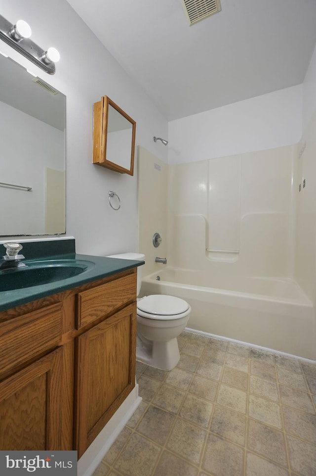 full bathroom featuring toilet, shower / tub combination, vanity, and tile patterned floors