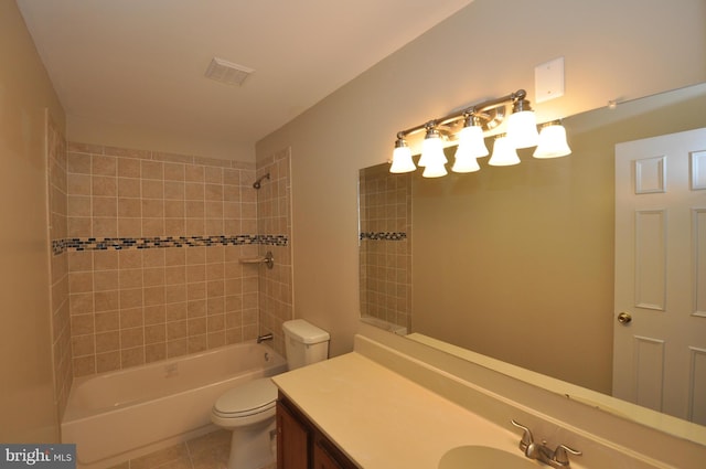 bathroom with tile patterned flooring, toilet, visible vents, vanity, and shower / bathing tub combination