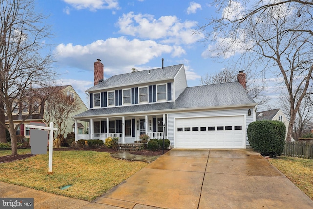 colonial house with a chimney, a porch, a garage, driveway, and a front lawn