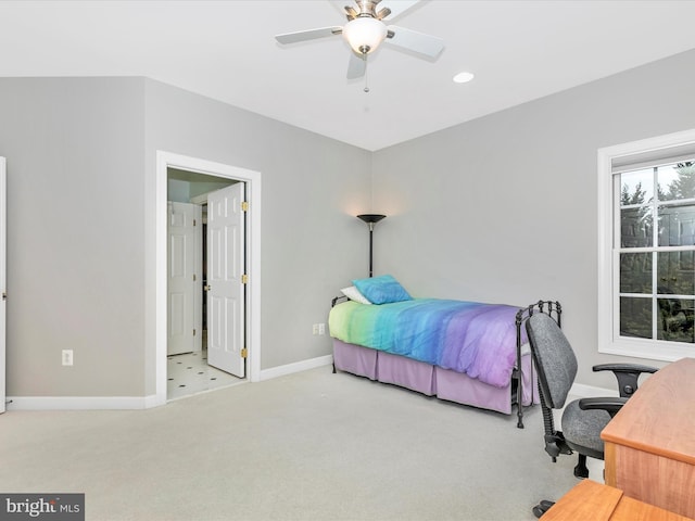 carpeted bedroom featuring ceiling fan and baseboards