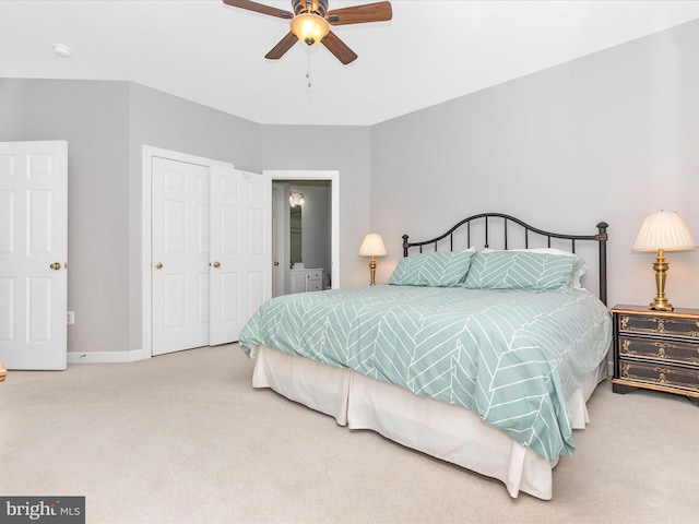 bedroom with a ceiling fan, baseboards, and carpet flooring