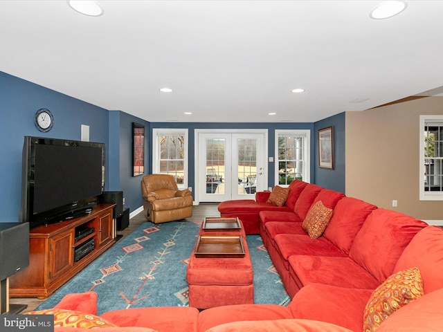 living area featuring baseboards, french doors, wood finished floors, and recessed lighting