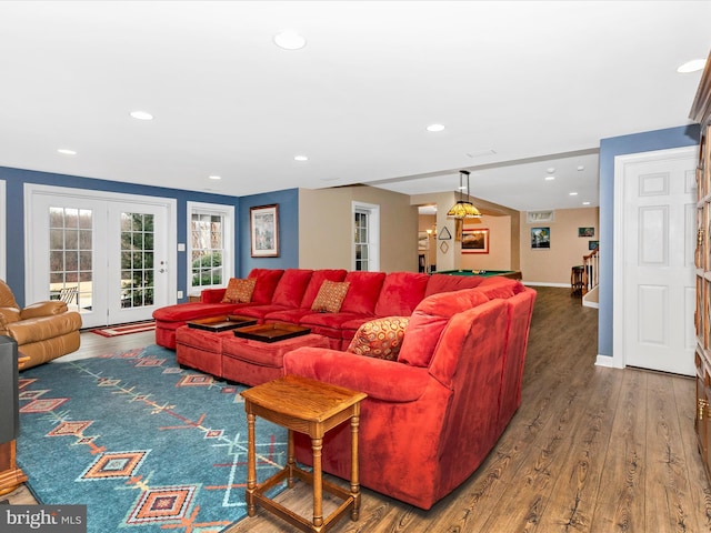 living area featuring recessed lighting, baseboards, and wood finished floors