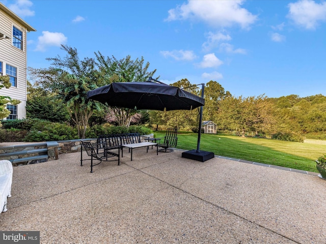 view of patio / terrace featuring an outbuilding and a storage shed